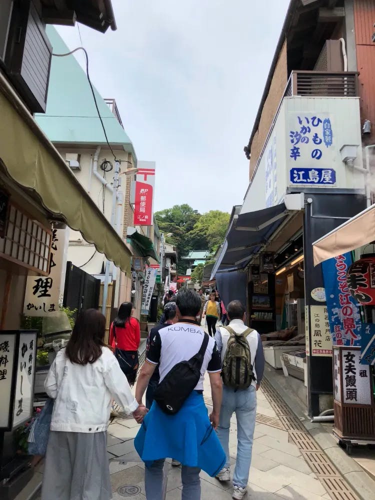 People walking along Benzaiten Nakamise Dori in Enoshima, Kanagawa Prefecture