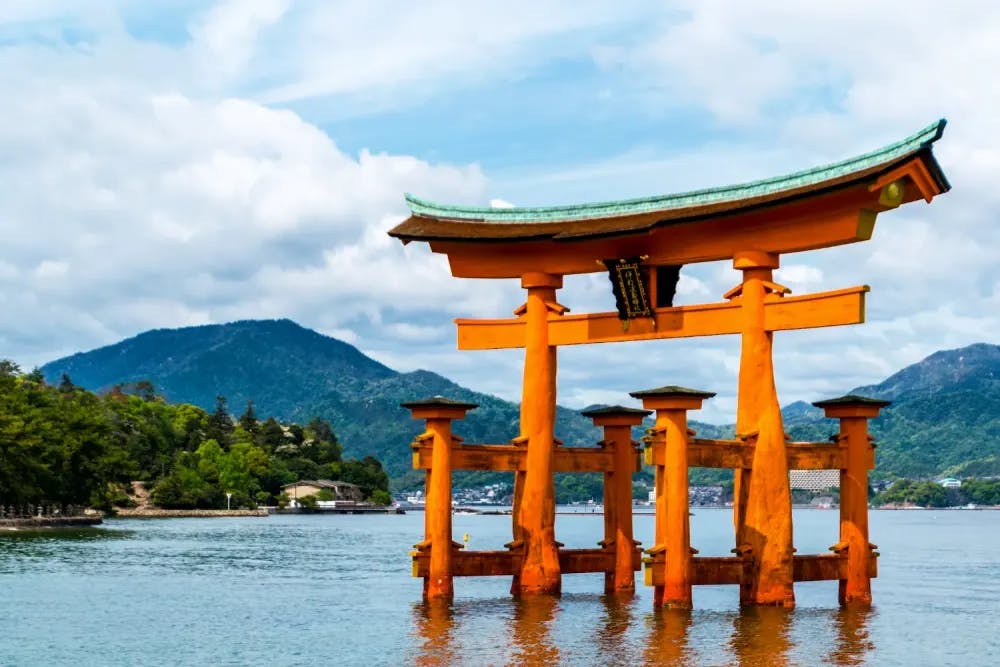 Floating torii gate above the water near Itsukushima Shrine in Hiroshima, Hiroshima Prefecture