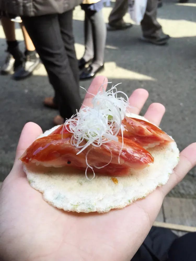 Hida Beef sushi served atop a cracker
