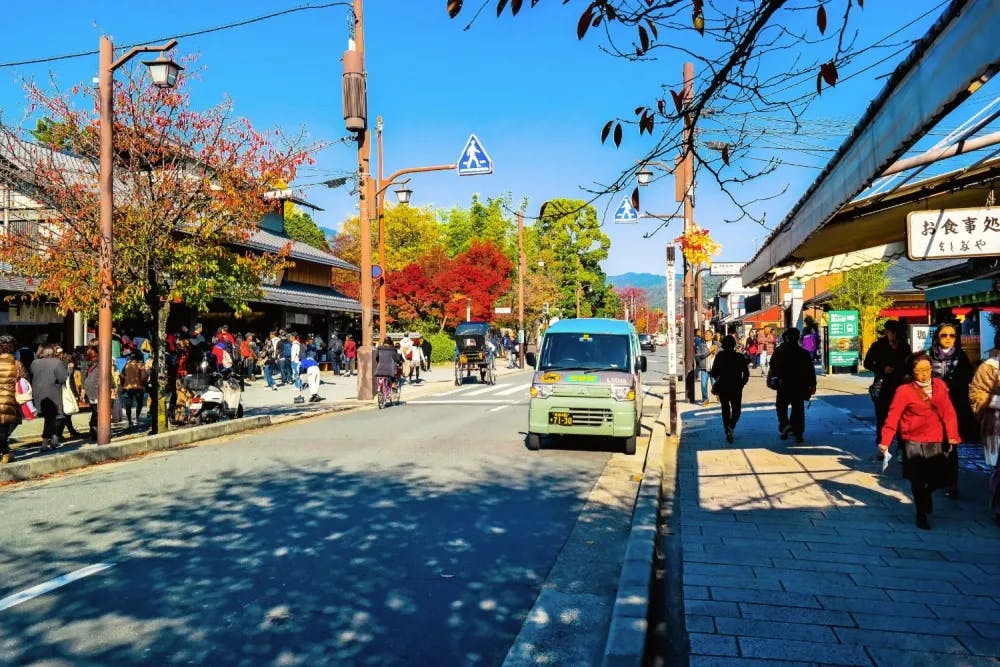 People walking down the shopping street in Arashiyama, Kyoto Prefecture