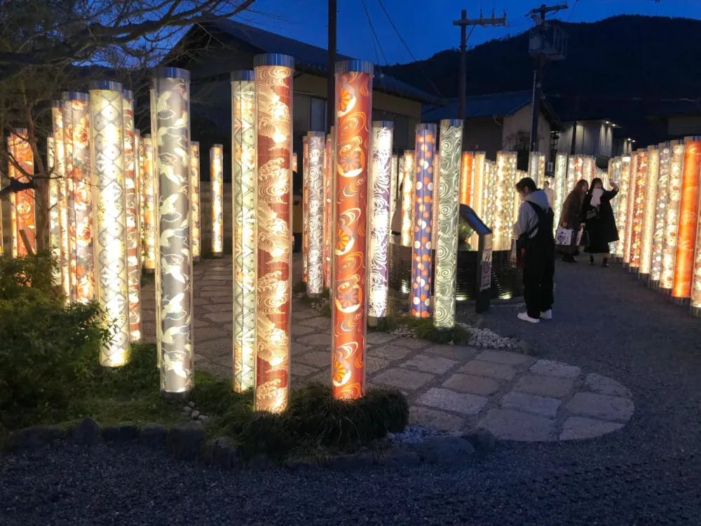 Kimono Forest with lighted pillars of kimono designs in Arashiyama, Kyoto Prefecture