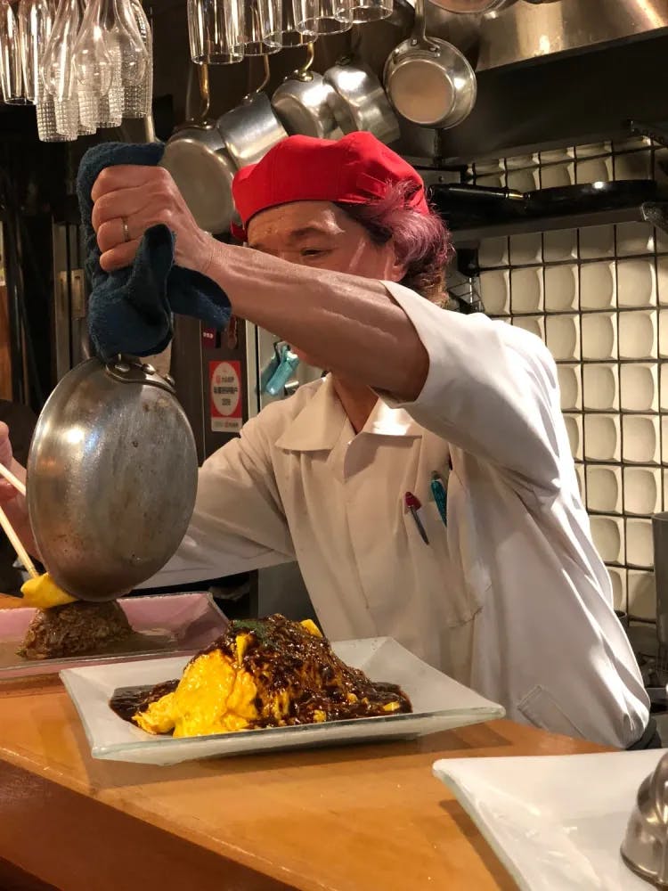 Chef serving up omurice at Kichi Kichi in Kyoto, Kyoto Prefecture