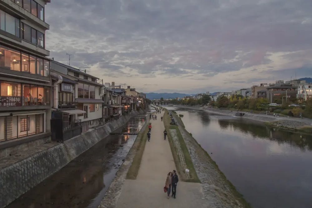 People strolling alongside the Kamo River in Kyoto, Kyoto Prefecture