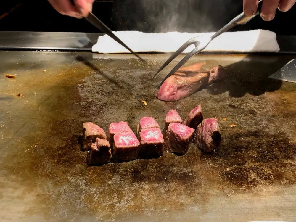 Steak being cooked atop a hot plate in Steakland Kobe in Kobe, Hyogo Prefecture