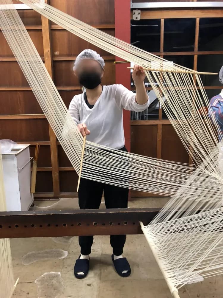 Lady stretching somen at a Somen Workshop