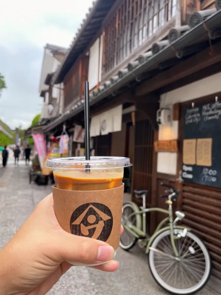 Cup of coffee outside Yamau Coffee Stand in Kurashiki, Okayama Prefecture