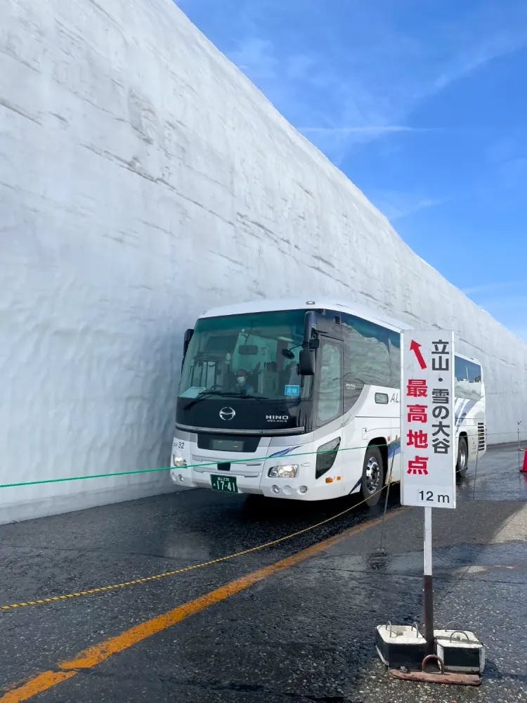 Bus Beside the Snow Wall